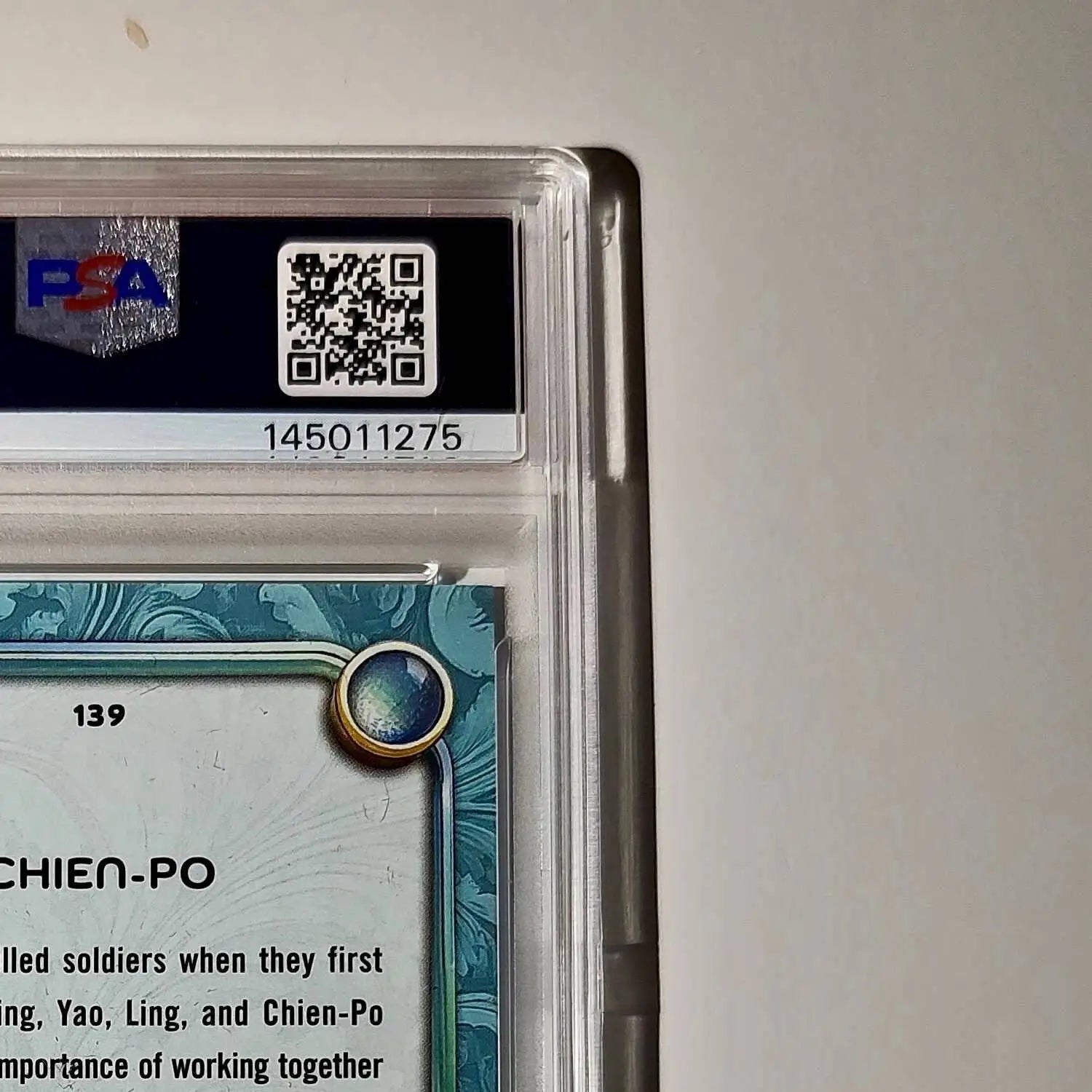 Chien-Po 2025 Topps Disney Wonder #139 Diamond Card Mulan PSA 7