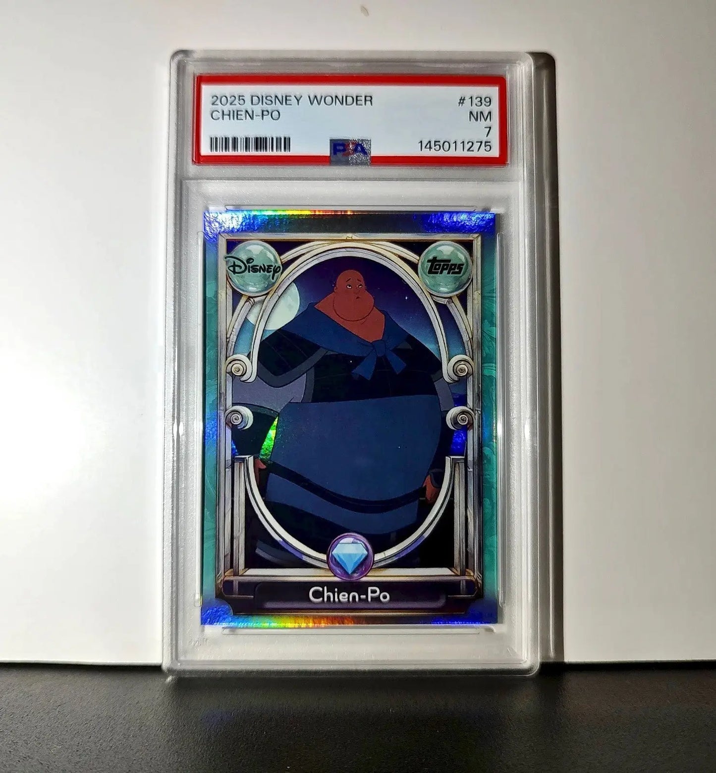 Chien-Po 2025 Topps Disney Wonder #139 Diamond Card Mulan PSA 7
