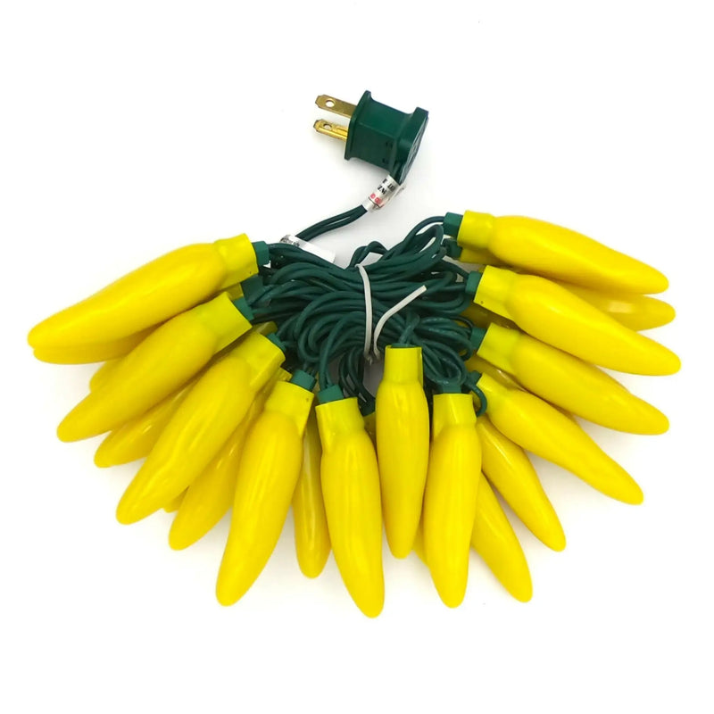 Yellow chili pepper string lights with green cord and two-prong plug for festive decor