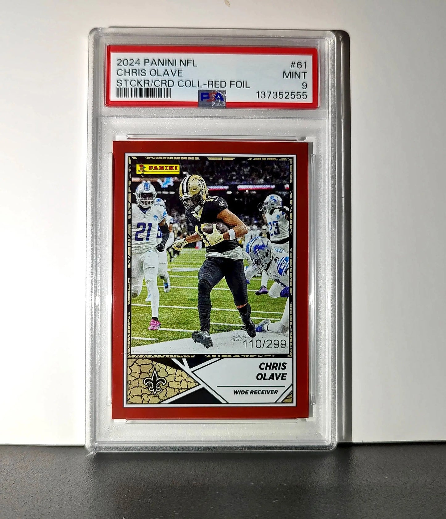 Chris Olave 2024 Panini Sticker Collection 110/299 #61 Red Foil PSA 9 Mint