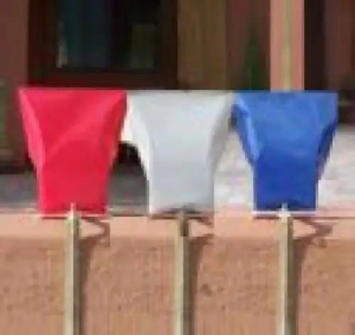 Colorful plastic flags on thin poles for electric luminarias and luminarias bags decoration