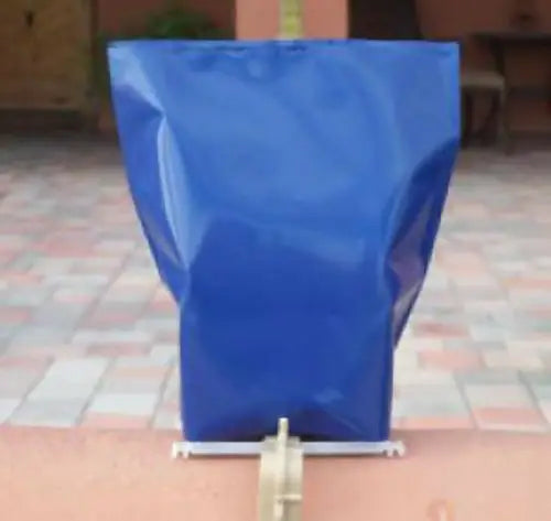 Blue collapsible water barrier from Classic LUMINARY SET with luminarias bags for outdoor lighting