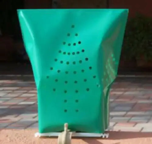 Green plastic luminarias bag with perforated Christmas tree design for electric luminarias