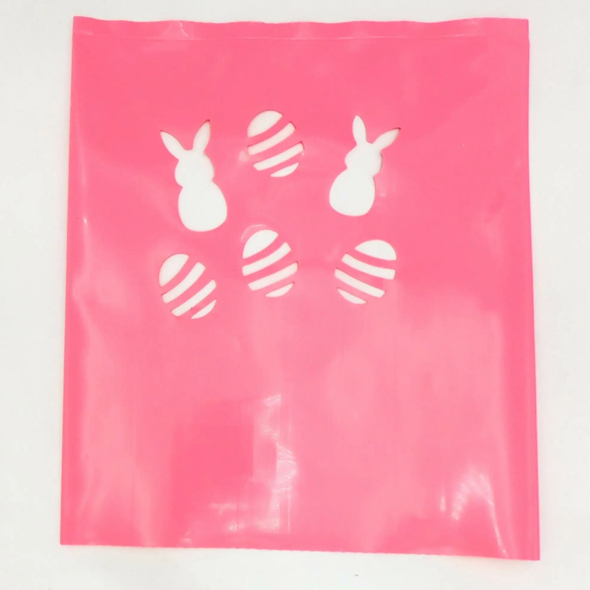 Pink plastic bag with white Easter bunny and egg cutouts for luminarias bags in Classic LUMINARY SET