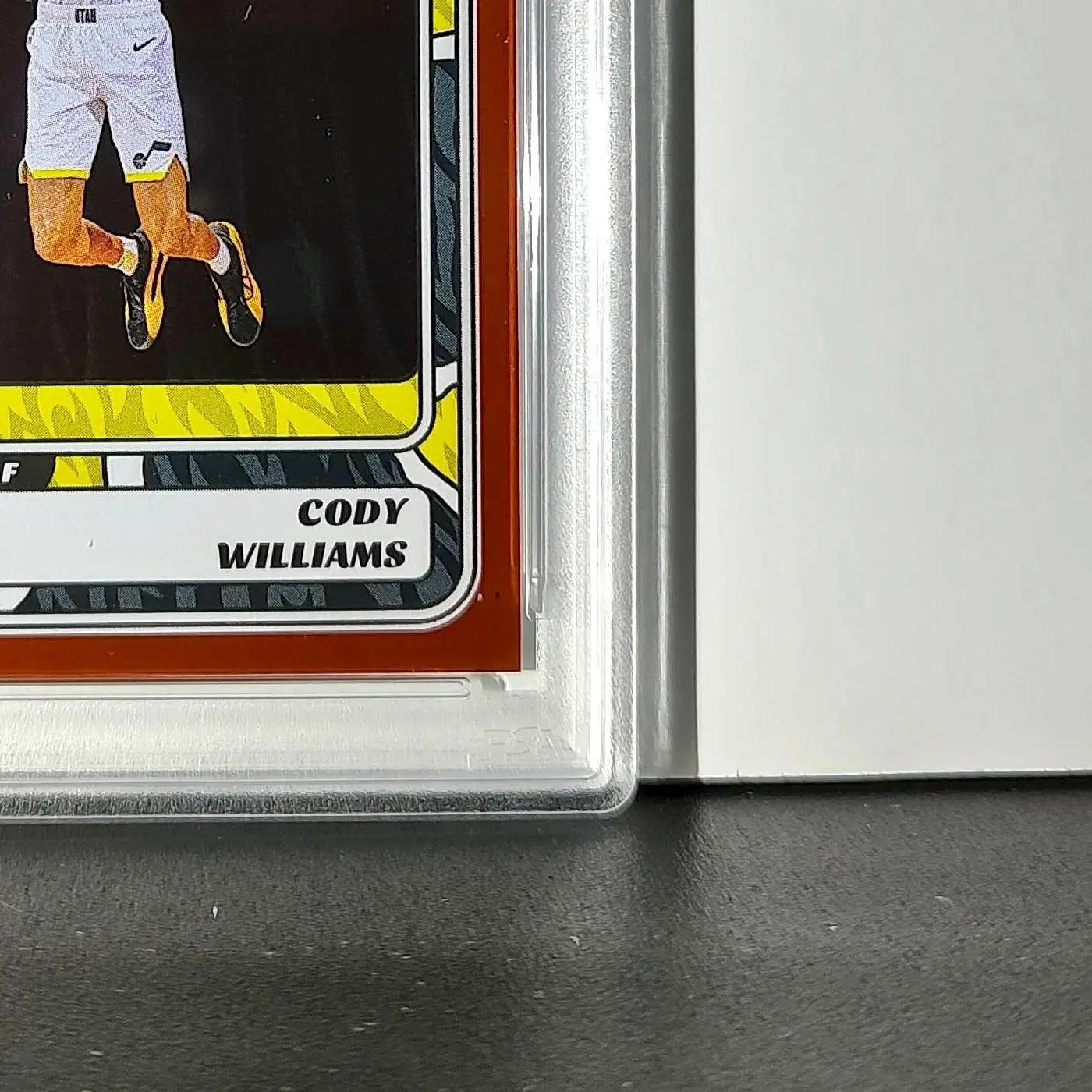 Cody Williams Rookie 2024-25 Panini NBA #99 Sticker 4/50 Orange Foil PSA 7 NM - Basketball Card Single