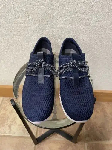 Pair of navy blue mesh Cole Haan Zerogrand women’s sneakers for stylish comfort