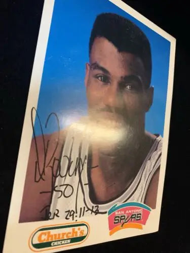 Signed David Robinson 5x7 promo card from San Antonio Spurs displayed for collectors