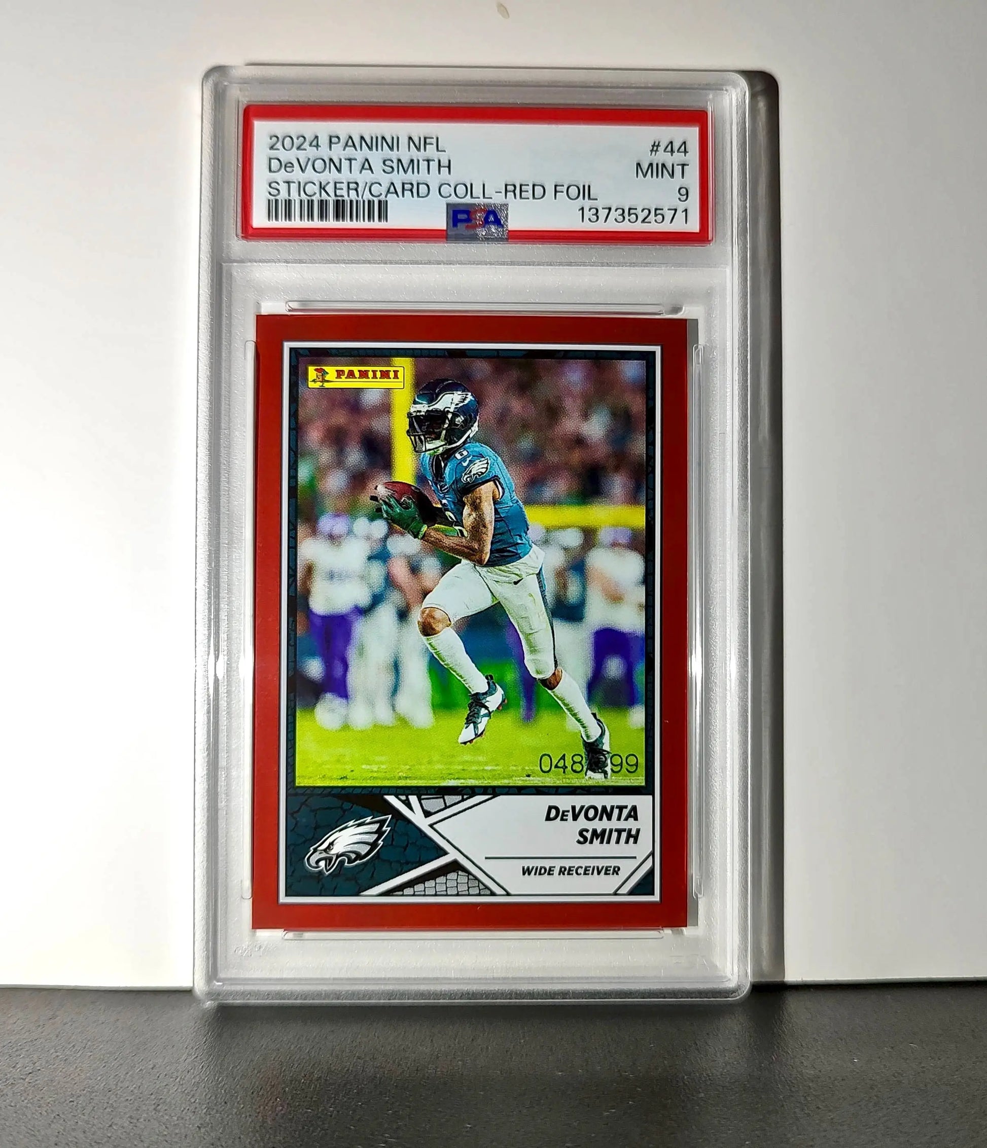 DeVonta Smith 2024 Panini Sticker Collection 048/299 #44 Red Foil PSA 9 Mint
