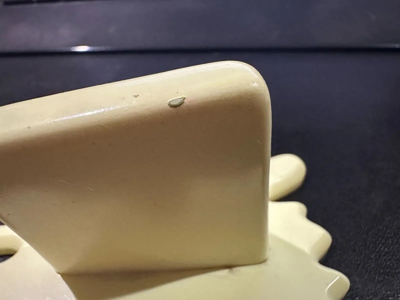 Cream-colored glossy decorative object for the Butter Barrage accessory from Diamond Select