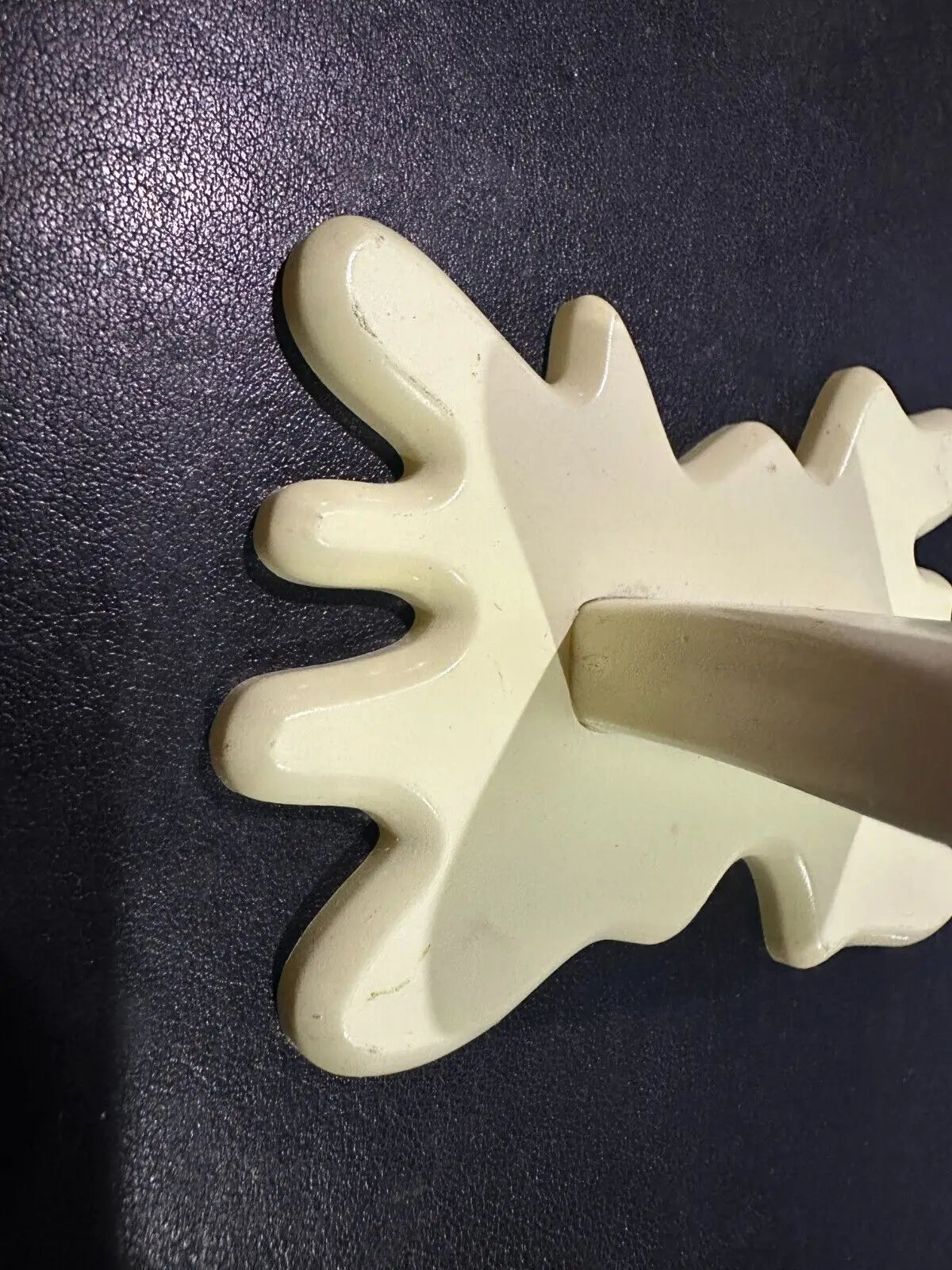 Cream-colored wooden coat hook for the Butter Barrage accessory from Plants vs Zombies