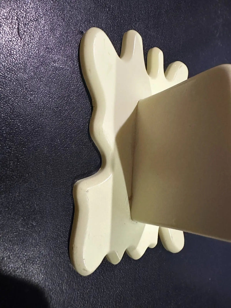 Cream-colored wall shelf with splash back for Diamond Select Butter Barrage accessory