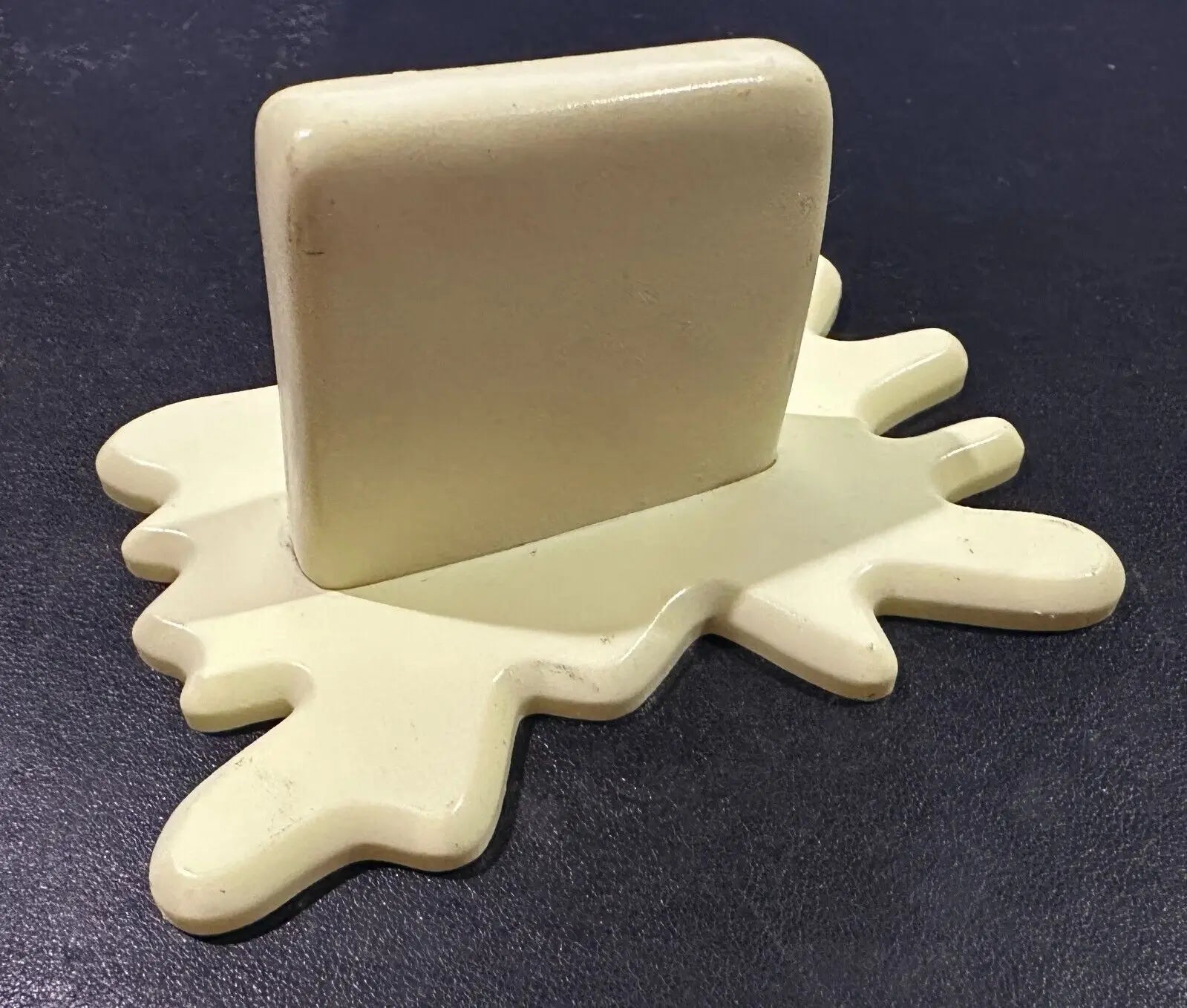 Cream-colored butter-shaped phone stand from Diamond Select Plants vs Zombies Butter Barrage accessory