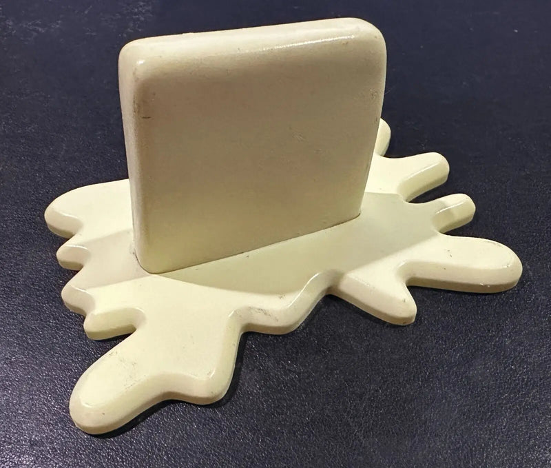 Cream-colored butter-shaped phone stand from Diamond Select Plants vs Zombies Butter Barrage accessory
