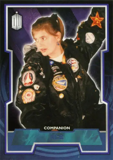 Trading card of Doctor Who character in black jacket with colorful patches, blue foil design