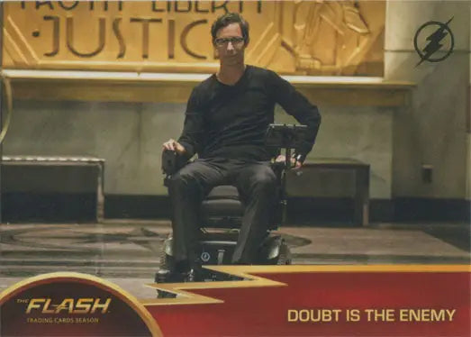 Man in wheelchair with Flash Season 1 Gold Logo Parallel Chase Card display