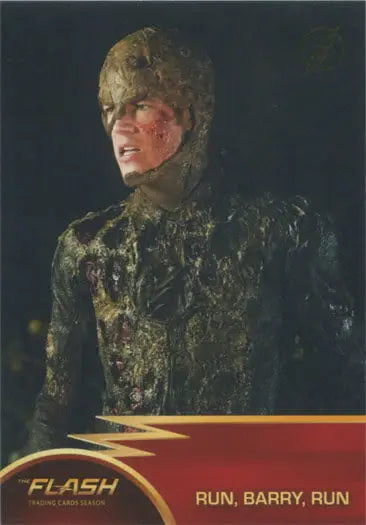 Costumed figure with moss-like covering from Flash Season 1 Gold Logo Parallel Chase Card