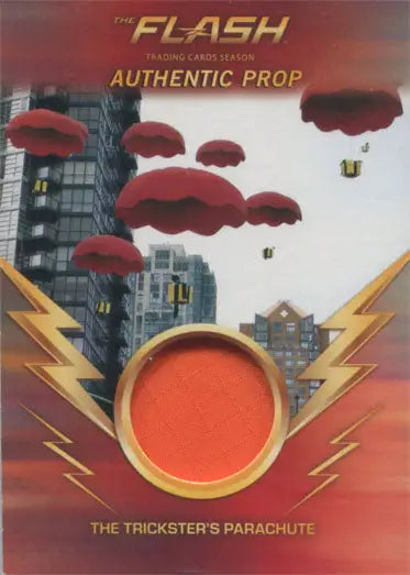 Circular orange fabric swatch labeled The Tricksters Parachute from Flash trading cards