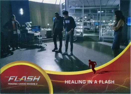 Trading card from The Flash with characters in a lab, featuring Scarlet Speedster Deco Red