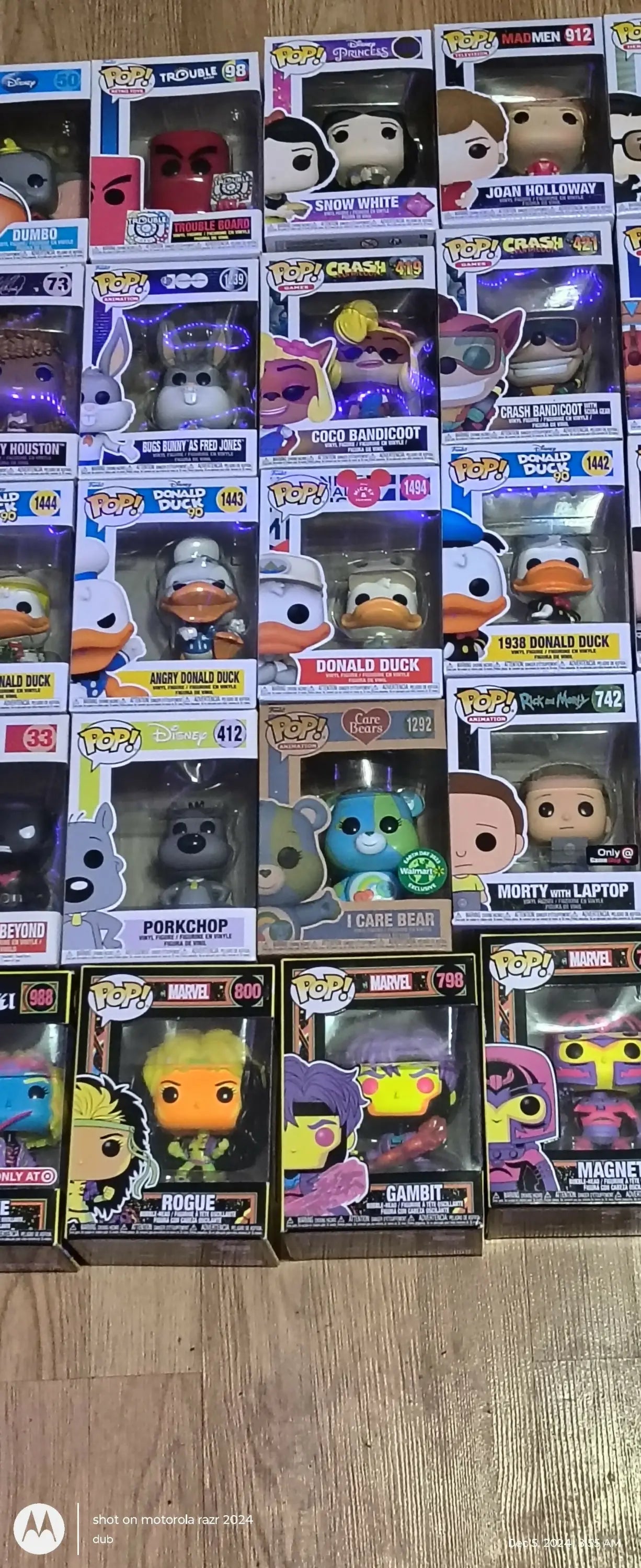 Colorful Funko Pops collection displayed alongside trading cards and baseball cards