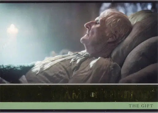 Elderly man reclining with eyes closed featured on Game of Thrones gold parallel trading card