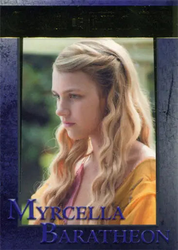 Portrait of a young woman with blonde hair in yellow, featured on a Gold Parallel trading card