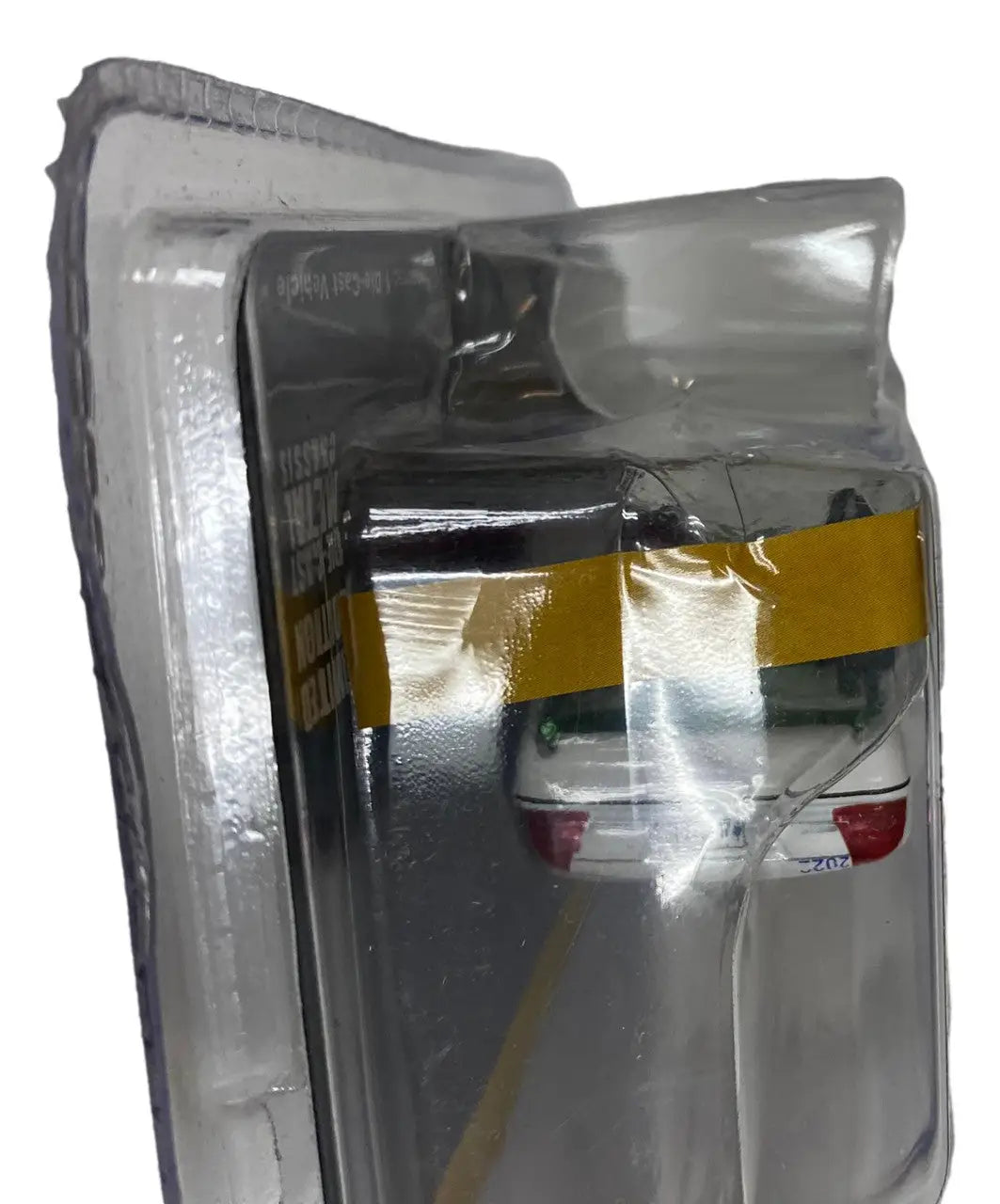 Damaged refrigerator reflecting Greenlight 1:64 Ford Crown Victoria Alabama State Police CHASE