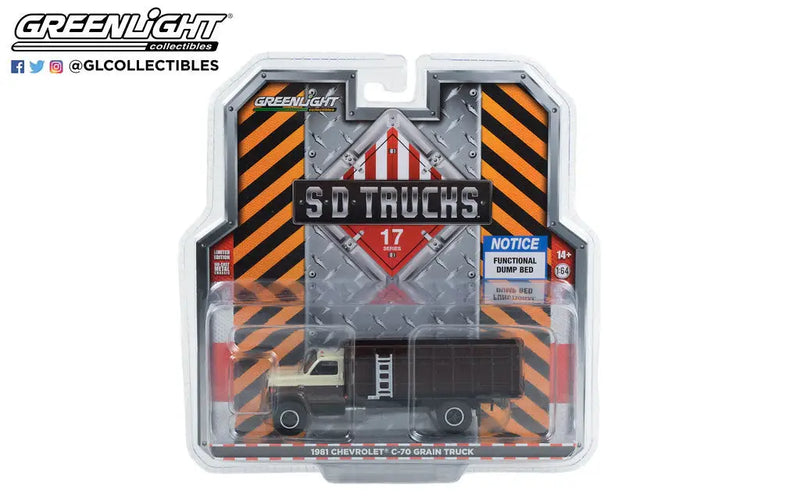 Die-cast model truck in packaging featuring SD Trucks branding and hazard stripes
