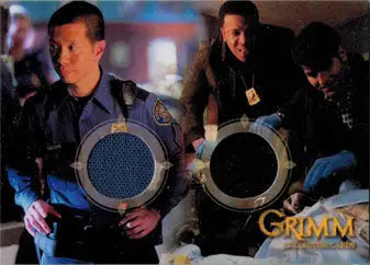 Reggie Lee and Russell Hornsby showcase Grimm 2013 trading cards with metallic frames