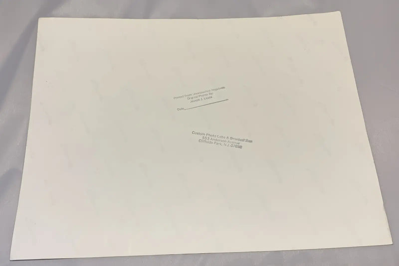 Off-white blank paper with curled edges and faded stamps, part of Johnny Bench sports memorabilia