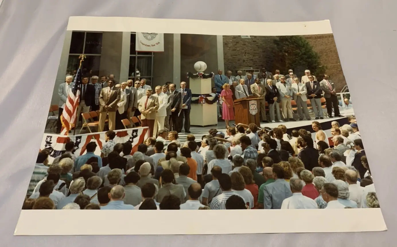 Vintage outdoor event photo featuring Johnny Bench and sports memorabilia from 1989 induction