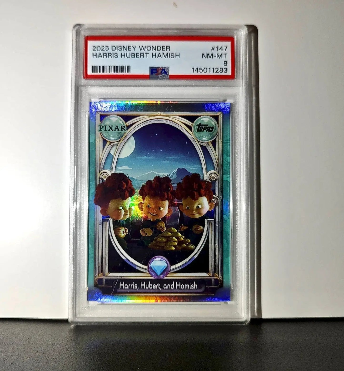 Harris Hubert and Hamish 2025 Topps Disney #147 Diamond Card Brave PSA 8 - Non-Sports Card Single
