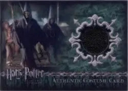 Circular dark fabric piece in ornate silver frame from C13A Death Eaters Costume Card