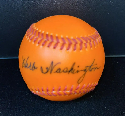 Orange baseball signed by Herb Washington, ideal for baseball cards collectors