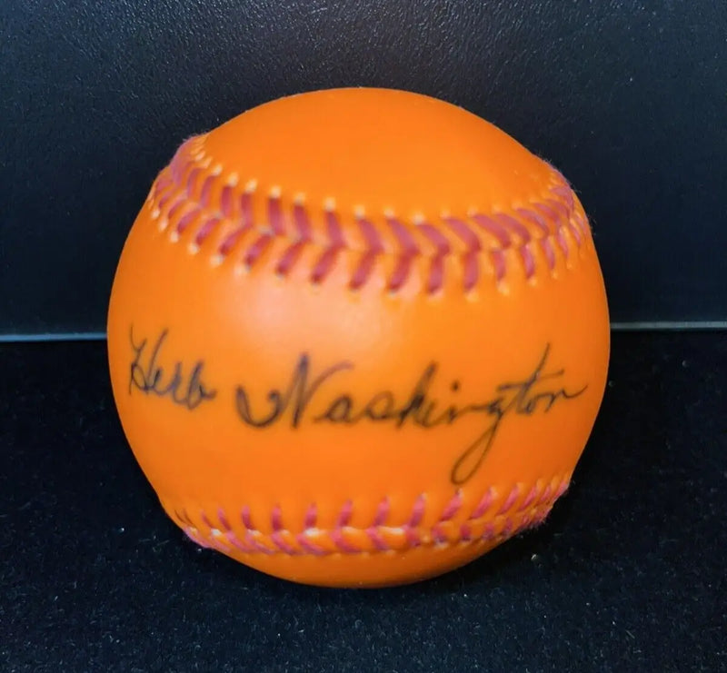 Orange baseball signed by Herb Washington, ideal for baseball cards collectors