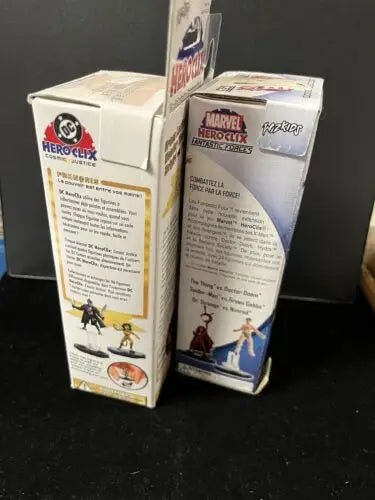 HeroClix Booster Pack Lot featuring DC Cosmic Justice and Marvel Fantastic Forces boxes