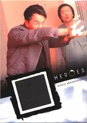 Trading card of two men in action with ’HEROES’ and a black fabric relic costume card