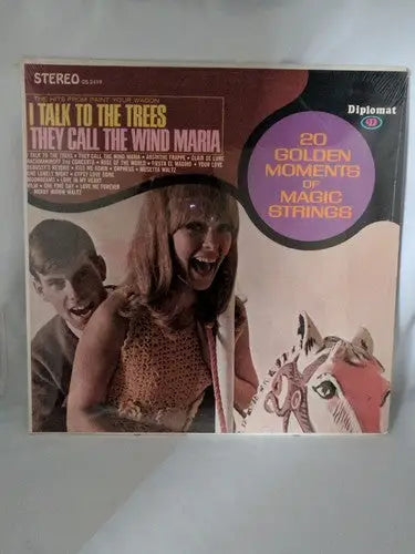 Vintage vinyl album cover featuring two young people and a carousel horse for Golden Moments Strings Wind Maria LP