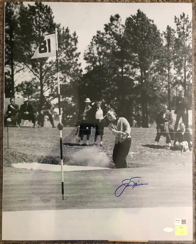 Black and white image of a golfer putting near water, Jack Nicklaus Autographed 16x20