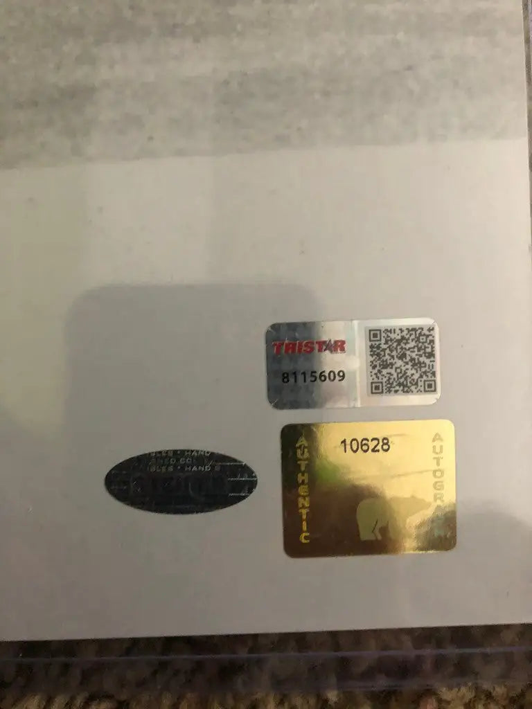 Collection of stickers, labels, QR code, and numbered tags for Jack Nicklaus autographed photo