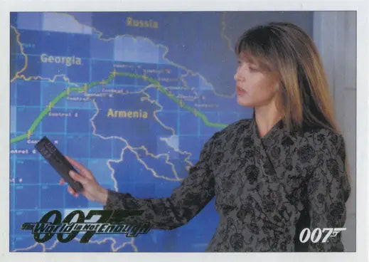 Woman in dark jacket points to map in James Bond 007 Classics Gold Parallel trading card