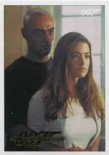 Two people in a gold parallel trading card featuring James Bond 007 The World Is Not Enough
