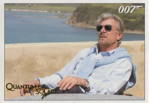 Man in sunglasses and light blue shirt outdoors for Solace Gold Chase Card image
