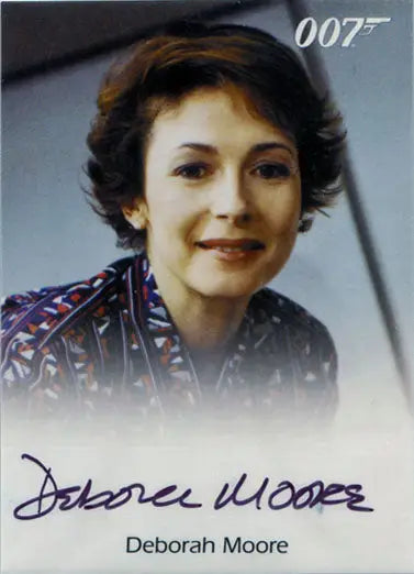 Headshot of smiling woman in patterned top for James Bond Autograph Card Deborah Moore