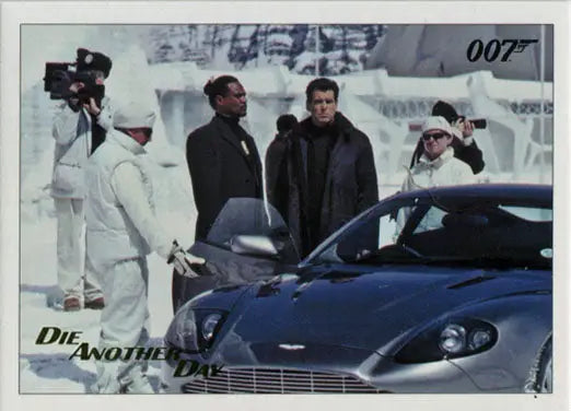 Movie scene with actors and blue sports car from Die Another Day on Gold Foil trading card