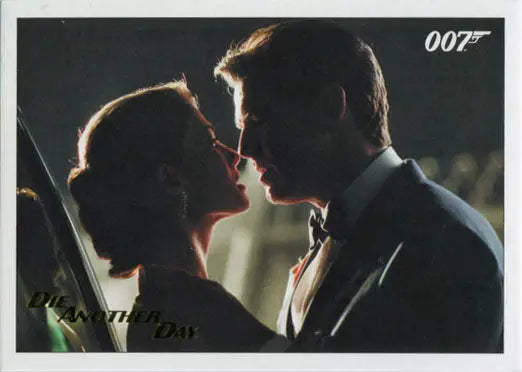 Silhouetted couple in formal attire about to kiss on James Bond trading card with gold foil