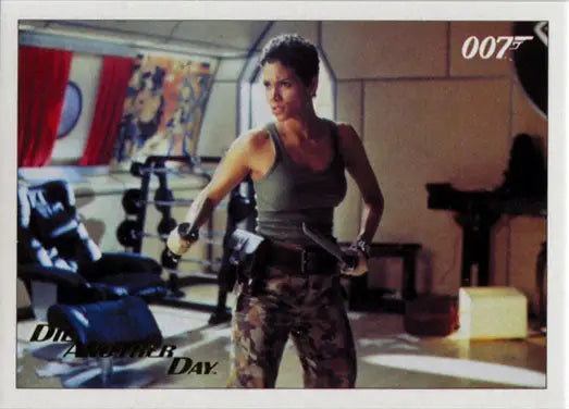 Athletic woman in tank top and camouflage pants posing for James Bond Gold Foil trading card