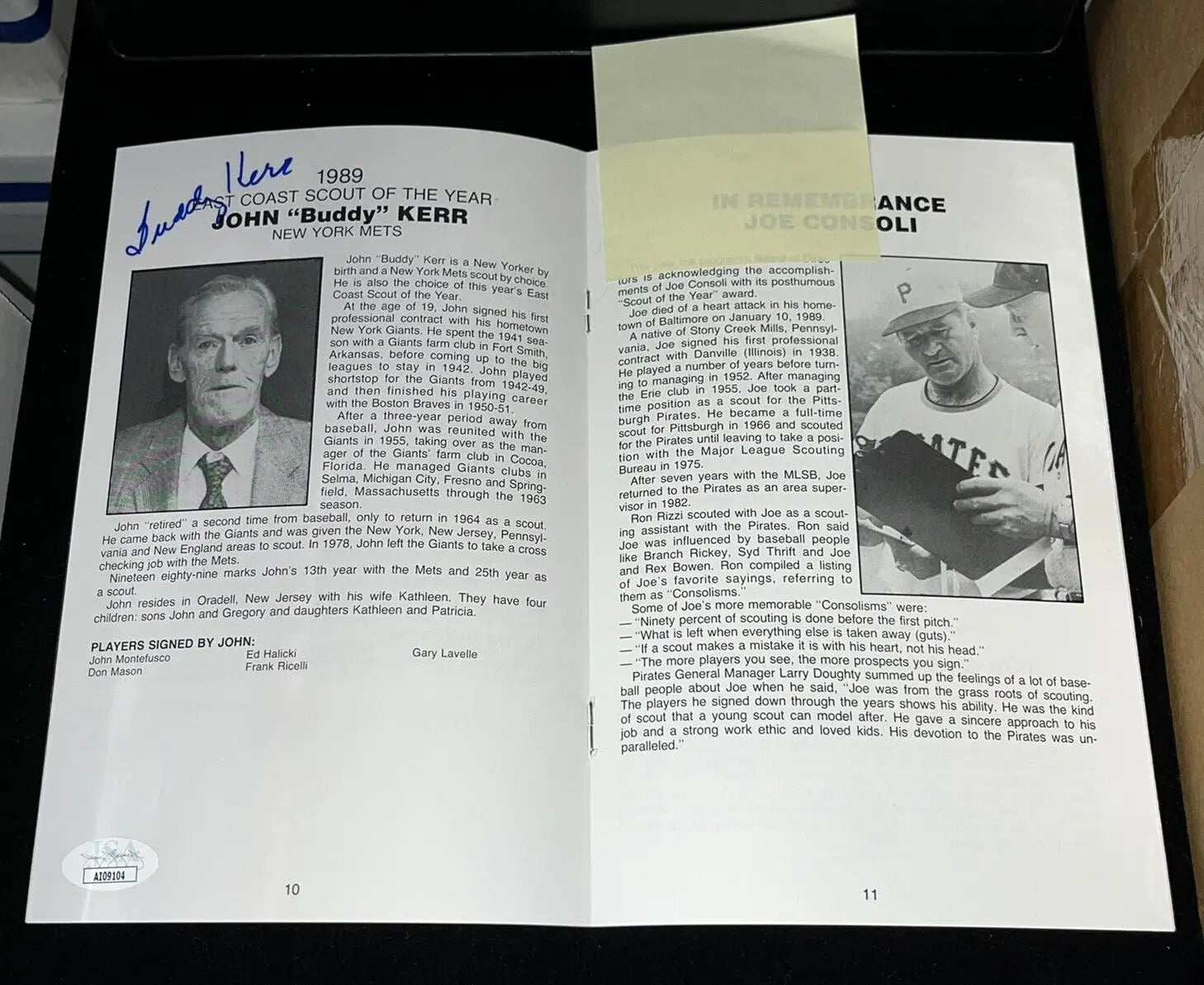 Open book showcasing Buddy Kerr program profiles and autographs from MLB Baseball Scout of the Year