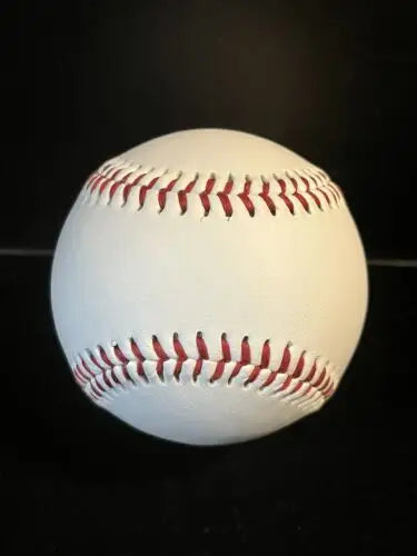 White baseball with red stitching featuring Karbach Round Rock Texas logo for college baseball