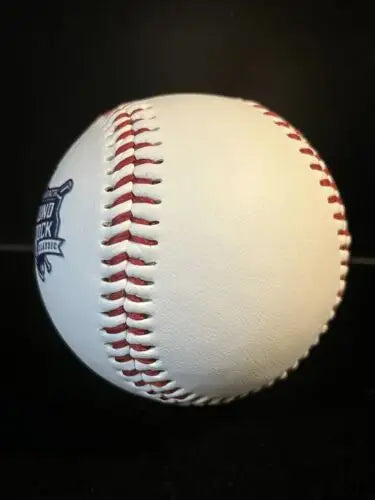White baseball with red stitching featuring Karbach Round Rock Texas College Baseball logo