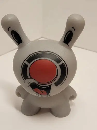 Gray rabbit-like Kidrobot Red Button Dunny figure with large red nose and wide open mouth